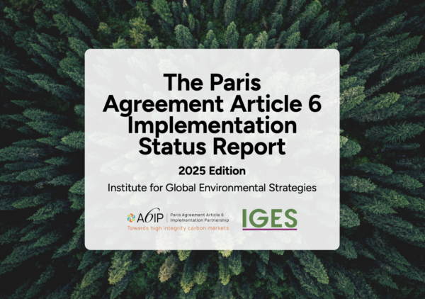 Cover of the The Paris Agreement Article 6 Implementation Status Report 2025 Edition with evergreen trees.