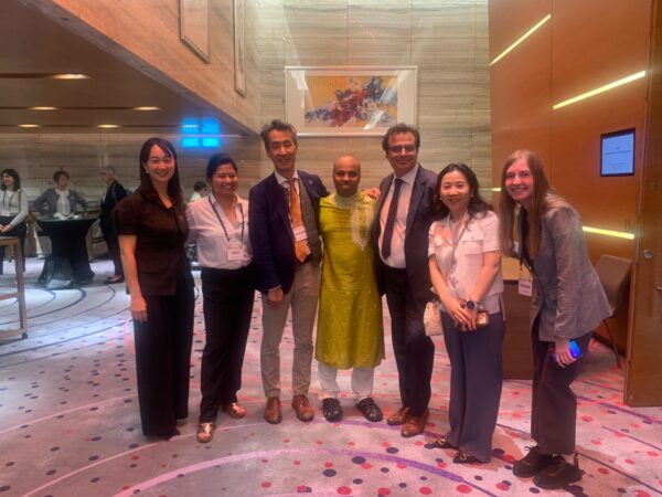 with partners in Singapore